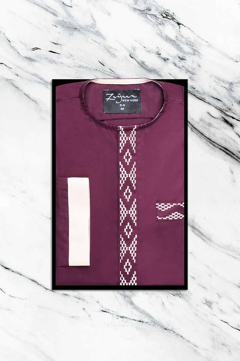 Folded Maroon Embroidered Emirati Thobe displayed in packaging with decorative neckline embroidery